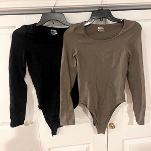 Two long sleeve bodysuits